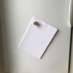 Whiteboard magnet holding 20 pieces of A4 paper.